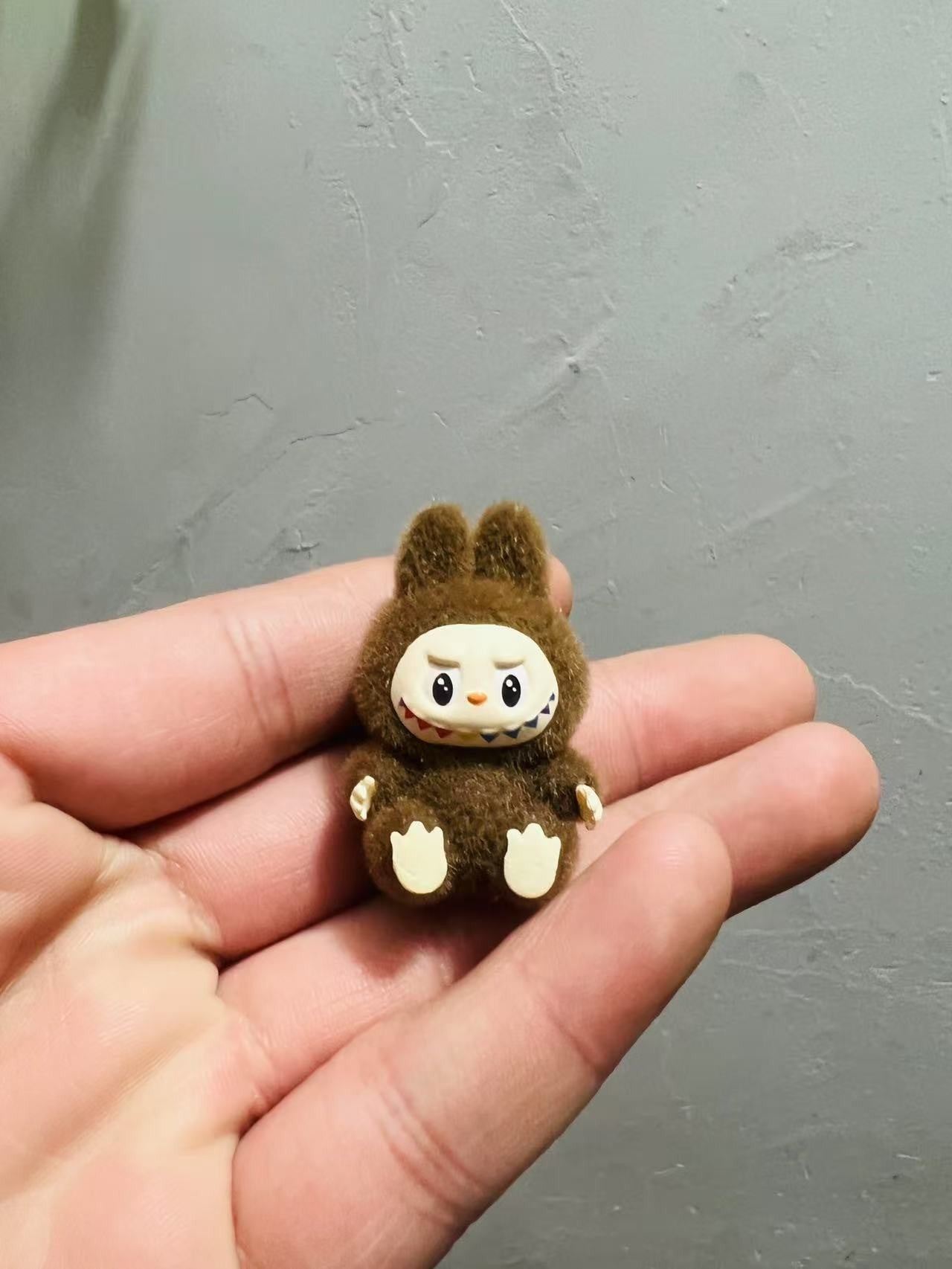 fluffy sitting labubu