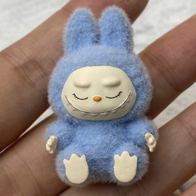 fluffy sitting labubu