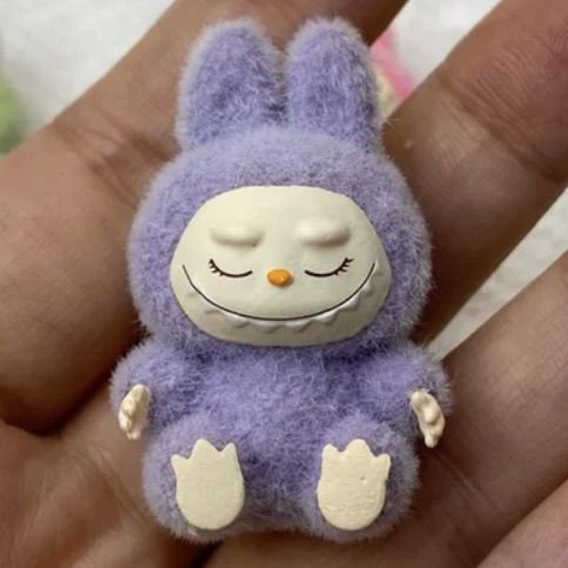 fluffy sitting labubu